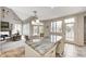 Bright kitchen and eat-in area, featuring granite island, and natural light at 6778 Old Hunt Club Rd, Zionsville, IN 46077