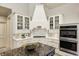 Well-lit kitchen with granite countertops, subway tile backsplash, white cabinets, and stainless steel appliances at 6778 Old Hunt Club Rd, Zionsville, IN 46077
