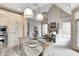 Open concept kitchen and living area with eat-in table and natural light at 6778 Old Hunt Club Rd, Zionsville, IN 46077