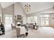 Spacious living room with fireplace, large windows, and comfortable seating at 6778 Old Hunt Club Rd, Zionsville, IN 46077