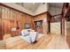 Elegant living room with wood paneling, fireplace, and comfortable seating at 6778 Old Hunt Club Rd, Zionsville, IN 46077