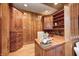 Charming home office with custom wood cabinetry, desk, and ample storage space at 6778 Old Hunt Club Rd, Zionsville, IN 46077