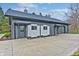 Well-maintained outbuilding, with two garage doors and a pedestrian door at 6778 Old Hunt Club Rd, Zionsville, IN 46077