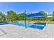 Relaxing inground pool area, with patio, mature landscaping, and shade canopies at 6778 Old Hunt Club Rd, Zionsville, IN 46077