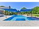 Inviting inground pool with large shade canopies and patio, set among lush landscaping at 6778 Old Hunt Club Rd, Zionsville, IN 46077