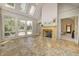 Bright sunroom with vaulted ceilings, tiled floors, a fireplace, and lots of windows at 6778 Old Hunt Club Rd, Zionsville, IN 46077