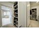 Walk-in closet with built-in shelving and hanging racks offering ample space at 6778 Old Hunt Club Rd, Zionsville, IN 46077