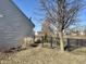 Fenced backyard featuring a lawn, landscaping and mature trees at 7156 Long Shore Cir, Indianapolis, IN 46217