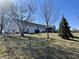 This home boasts a spacious backyard with a screened-in porch, perfect for outdoor relaxation and entertaining at 7156 Long Shore Cir, Indianapolis, IN 46217