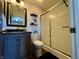 Well-lit bathroom featuring a shower, vanity with storage, and neutral décor at 7156 Long Shore Cir, Indianapolis, IN 46217