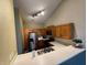 The kitchen features stainless steel appliances and hardwood floors, in a home with neutral walls at 7156 Long Shore Cir, Indianapolis, IN 46217