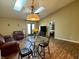 Cozy living room featuring a glass table, skylights, and comfortable seating at 7156 Long Shore Cir, Indianapolis, IN 46217