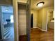View of a pantry with wire shelving, and a room with a desk, in a home with hard wood floors at 7156 Long Shore Cir, Indianapolis, IN 46217
