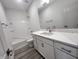 A bathroom featuring a vanity with drawers and cabinets, a tub, and tiled shower at 737 Madelyn Dr, Carmel, IN 46032