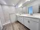A Primary bathroom featuring a double vanity, a walk-in shower, and tile flooring at 737 Madelyn Dr, Carmel, IN 46032