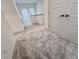 A hallway with carpet and access to one or more rooms through white doors at 737 Madelyn Dr, Carmel, IN 46032