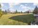 Expansive backyard with lush green lawn and mature trees, providing ample space for outdoor activities and relaxation at 7619 Bluebird Ct, Brownsburg, IN 46112