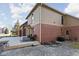 Spacious backyard featuring a wooden deck, brick facade, and concrete-paved patio at 7619 Bluebird Ct, Brownsburg, IN 46112