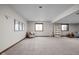 Spacious finished basement with neutral carpet, seating, and decor, offering a cozy and versatile living space at 7619 Bluebird Ct, Brownsburg, IN 46112