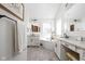 Luxurious bathroom featuring double vanities, granite countertops, a standalone tub, and stylish fixtures at 7619 Bluebird Ct, Brownsburg, IN 46112