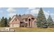 Stunning red brick two-story home featuring manicured landscaping and a two car attached garage at 7619 Bluebird Ct, Brownsburg, IN 46112