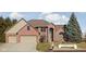Charming red brick home with a well-maintained lawn and a two car attached garage at 7619 Bluebird Ct, Brownsburg, IN 46112