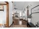 Grand foyer with hardwood floors leading to a living room with a fireplace and vaulted ceilings at 7619 Bluebird Ct, Brownsburg, IN 46112