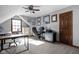 Spacious office with multiple workstations, natural light and neutral walls at 7619 Bluebird Ct, Brownsburg, IN 46112