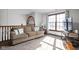Upstairs living room with comfortable seating, large window, and natural light at 7619 Bluebird Ct, Brownsburg, IN 46112