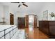Cozy main bedroom with hardwood floors and dressers, leading to a spa-like bathroom at 7619 Bluebird Ct, Brownsburg, IN 46112
