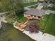 Beautiful backyard featuring a spacious deck, wooden stairs, and waterfront access at 7987 Teal Dr, Coatesville, IN 46121