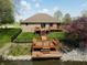Lovely backyard with a spacious deck, lush green grass, and waterfront access for relaxation at 7987 Teal Dr, Coatesville, IN 46121
