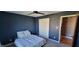 Comfortable bedroom featuring cozy carpet, a ceiling fan and closet for storage at 7987 Teal Dr, Coatesville, IN 46121