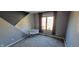 Comfortable bedroom with fun wall design and natural light from the window at 7987 Teal Dr, Coatesville, IN 46121