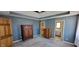 Spacious primary bedroom showcasing carpet floors and plenty of natural light at 7987 Teal Dr, Coatesville, IN 46121