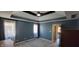 Light filled bedroom with a trey ceiling and a ceiling fan at 7987 Teal Dr, Coatesville, IN 46121