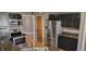 Kitchen featuring stainless steel appliances, black cabinetry, and countertops at 7987 Teal Dr, Coatesville, IN 46121