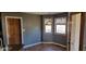 Bright eat-in kitchen area with charming pendant lighting and view to outdoors at 7987 Teal Dr, Coatesville, IN 46121