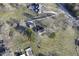 Aerial view of the residence and garage, plus expansive land and mature trees at 8090 E 550 S, Zionsville, IN 46077