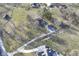 Aerial view of the home, garage, and outbuilding, plus expansive land and mature trees at 8090 E 550 S, Zionsville, IN 46077