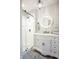 This bathroom has a glass enclosed shower and a single vanity with an illuminated mirror at 8090 E 550 S, Zionsville, IN 46077