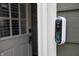Smart doorbell with a camera is located on the green siding by the front door at 8090 E 550 S, Zionsville, IN 46077