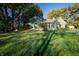 Two-story home on a large lot, featuring mature trees and lush green lawn at 8090 E 550 S, Zionsville, IN 46077