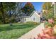 Exterior view of a charming home with lush landscaping and a well-manicured lawn at 8090 E 550 S, Zionsville, IN 46077