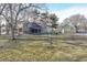 Exterior view of the home with an American flag in the front yard on a sunny day at 8090 E 550 S, Zionsville, IN 46077