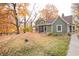 Charming home featuring a leafy front yard with mature trees displaying colorful autumn foliage at 8090 E 550 S, Zionsville, IN 46077