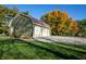 Exterior view of a detached two-car garage on a spacious lot, with fall foliage at 8090 E 550 S, Zionsville, IN 46077