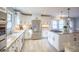 Spacious kitchen with granite countertops, stainless steel appliances, custom white cabinets and a kitchen island at 8090 E 550 S, Zionsville, IN 46077