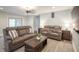 This living room has two reclining couches and a wooden coffee table on top of hardwood floors at 8090 E 550 S, Zionsville, IN 46077