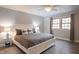 Bright main bedroom with large bed, ceiling fan, and two windows at 8090 E 550 S, Zionsville, IN 46077